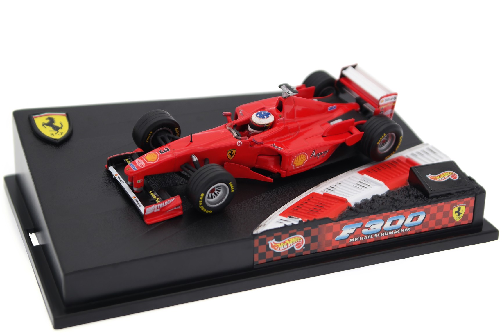 A collectible scale model Ferrari F300 from Hot Wheels F1