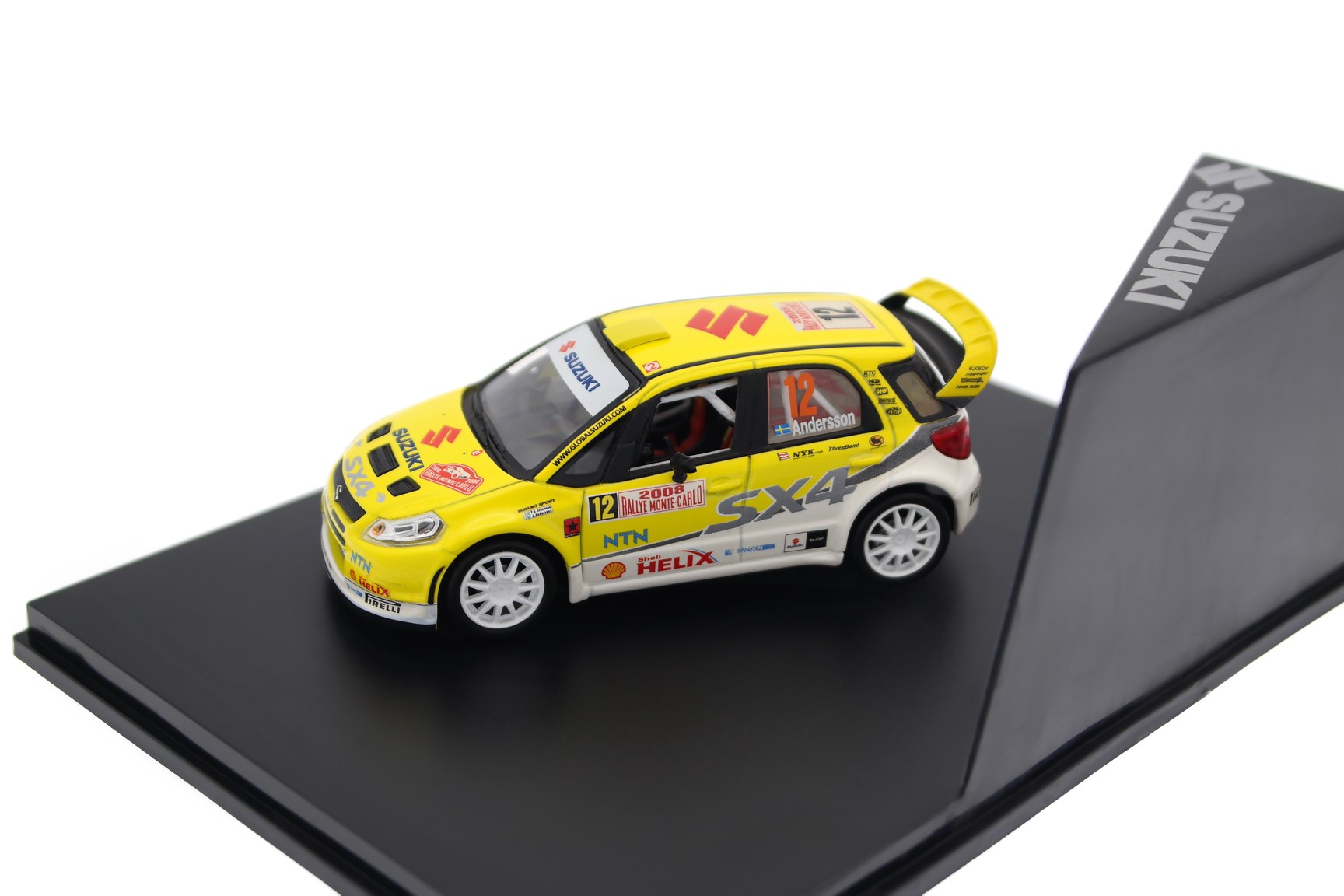 A collectible scale model Suzuki SX4 WRC Rally Monte-Carlo from Norev