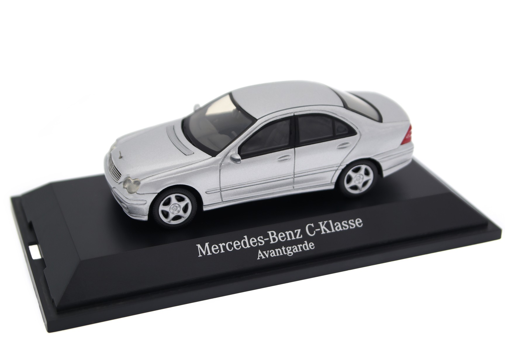 A collectible scale model Mercedes-Benz C-Class from Schuco