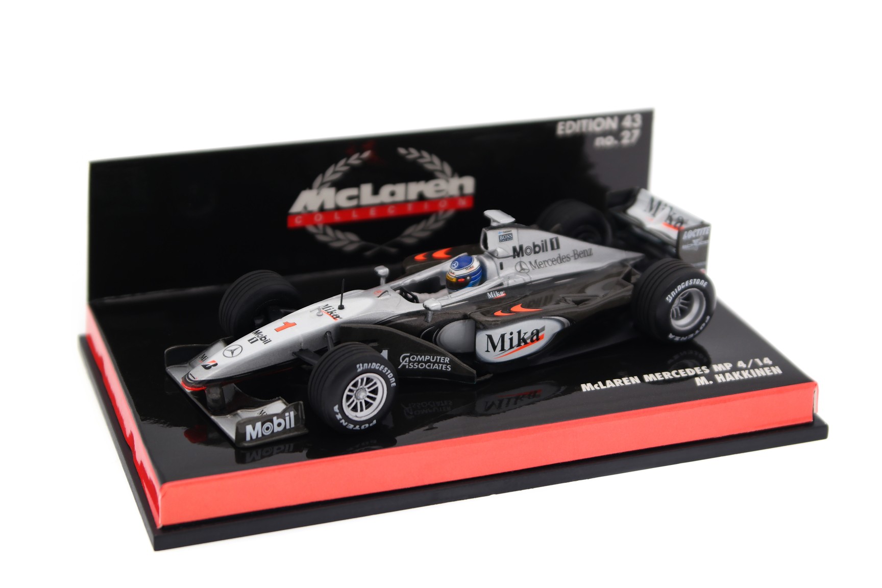 A collectible scale model McLaren MP4/14 from Minichamps F1