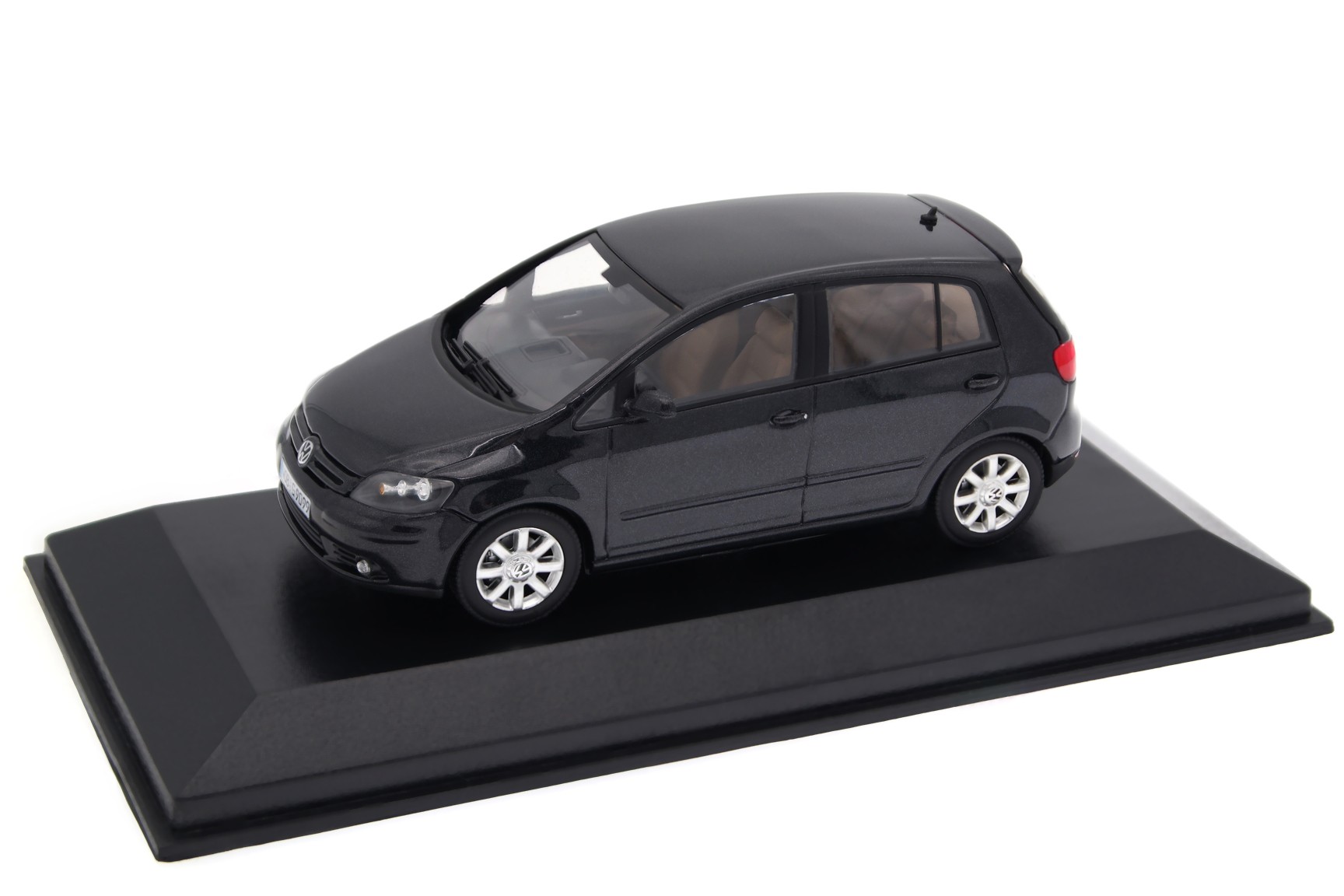A collectible scale model VW Golf Plus from Minichamps